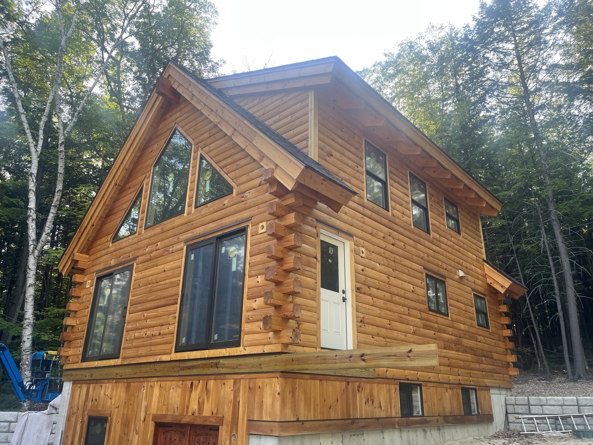 Freedom log home shell near completion, side angle