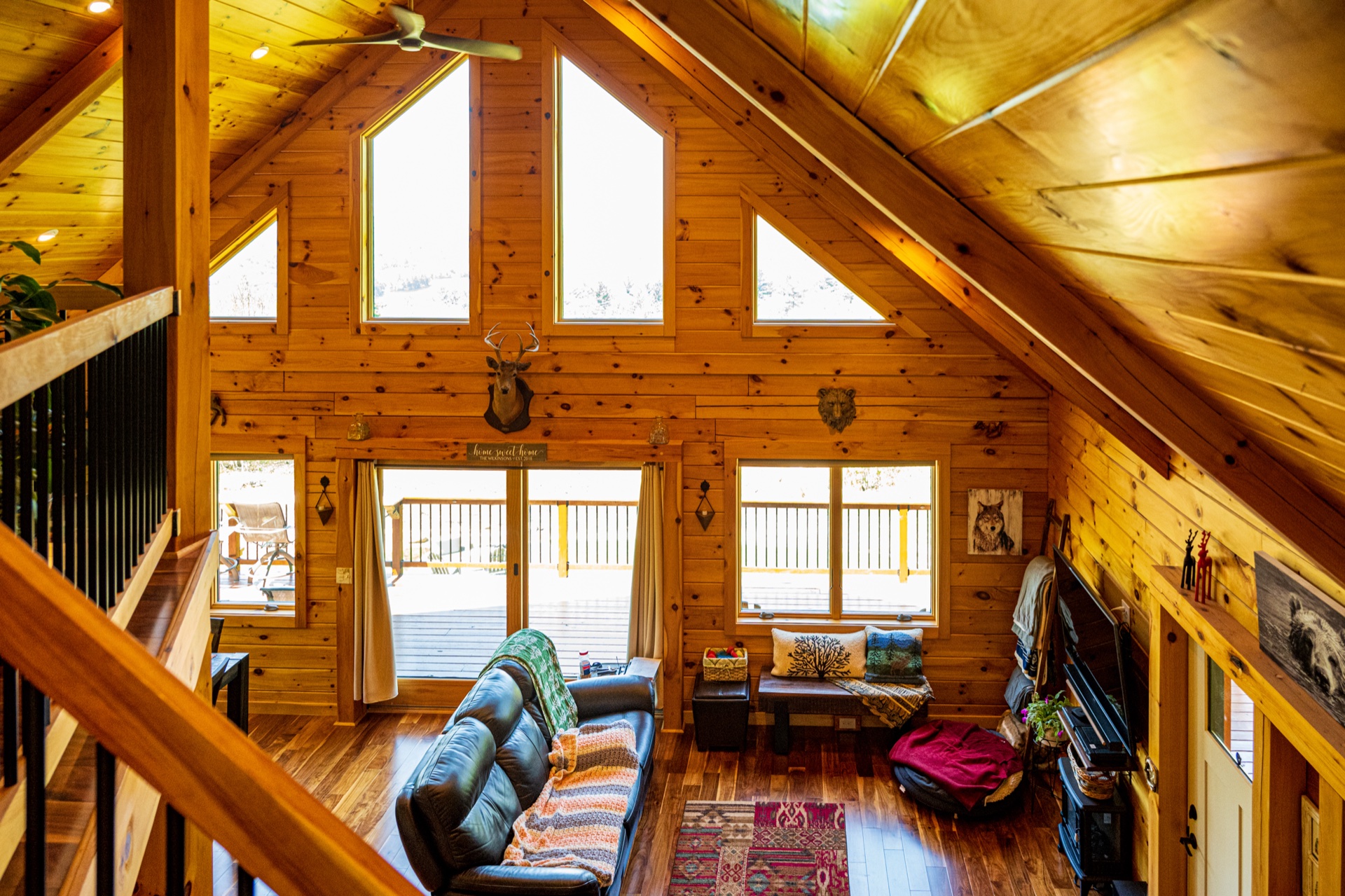 Ossipee great room viewed from the loft balcony with cathedral ceiling and chalet windows