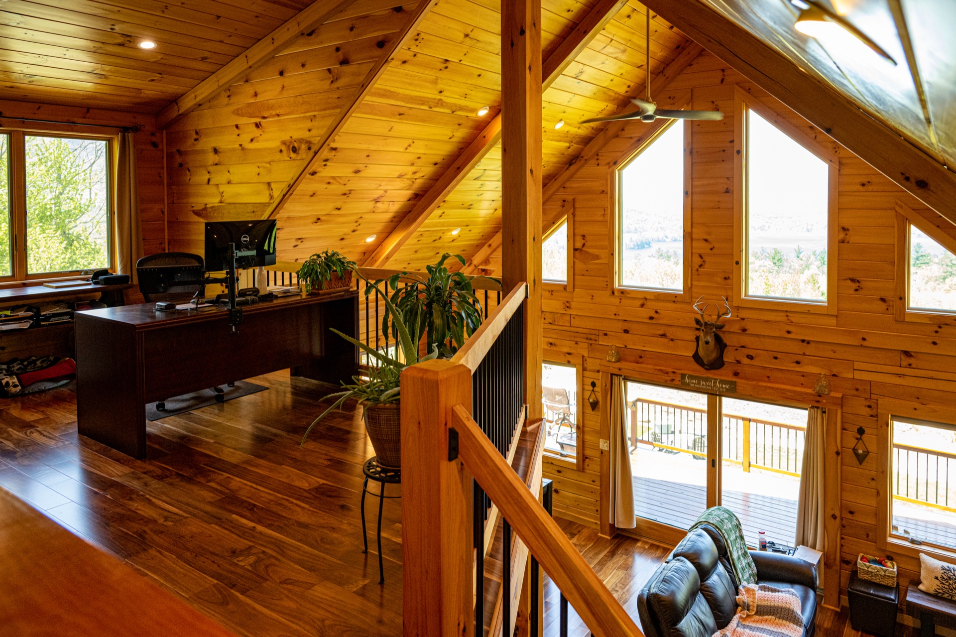 Ossipee loft balcony overlooking the great room with chalet windows