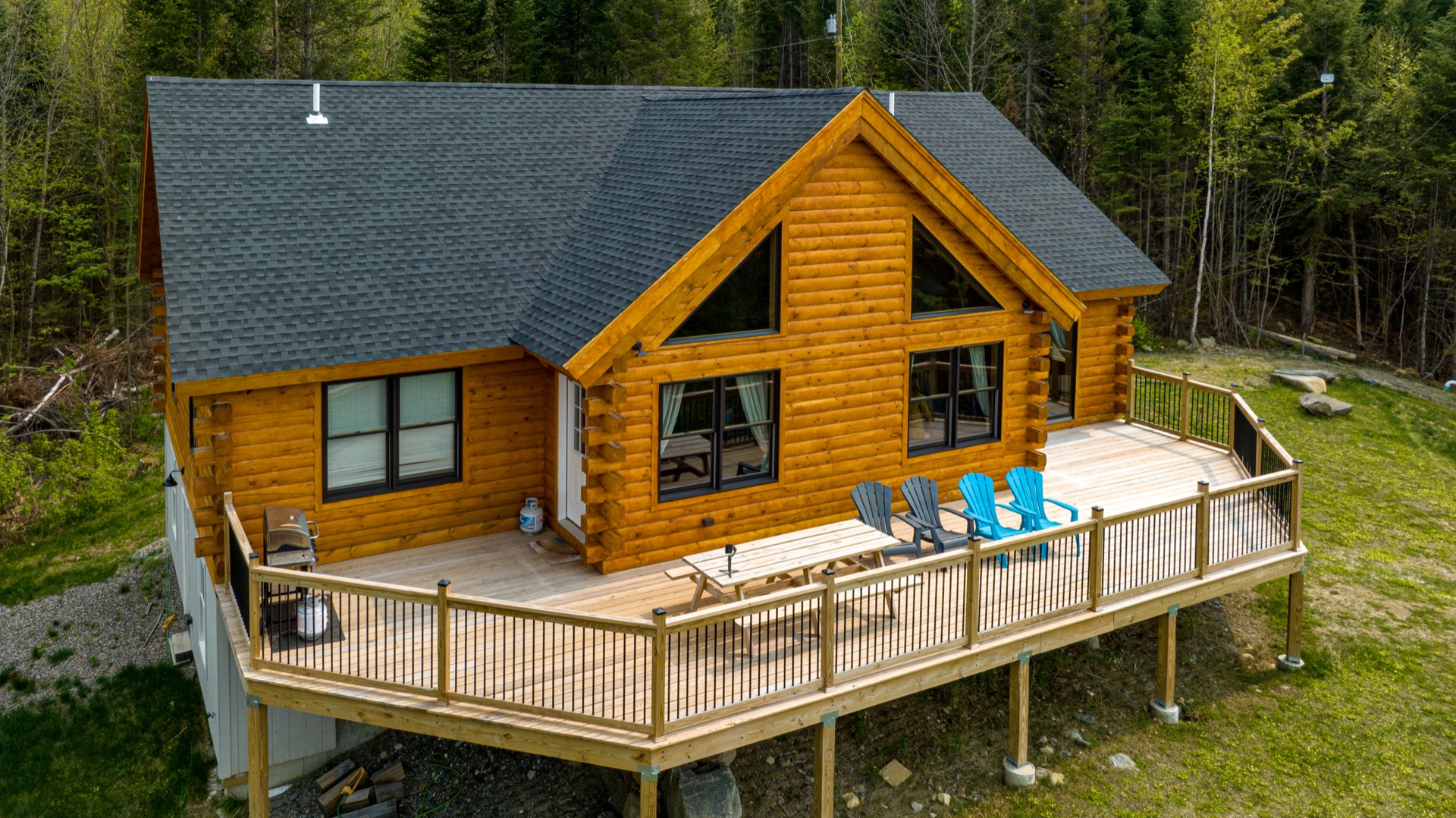 Aerial view of the Sunapee deck with adirondack chairs and outdoor seating