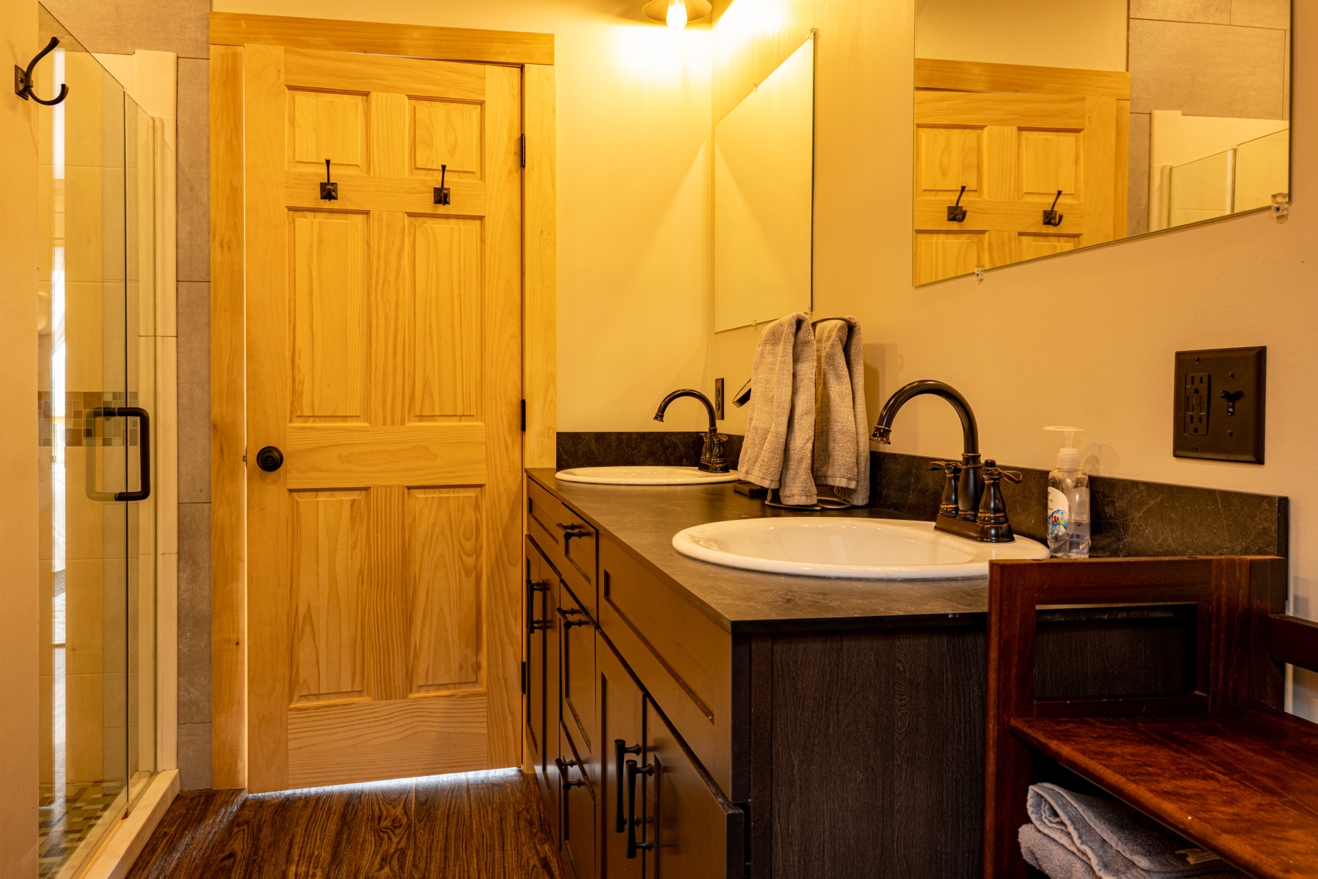 Sunapee bathroom with single sink vanity and glass shower