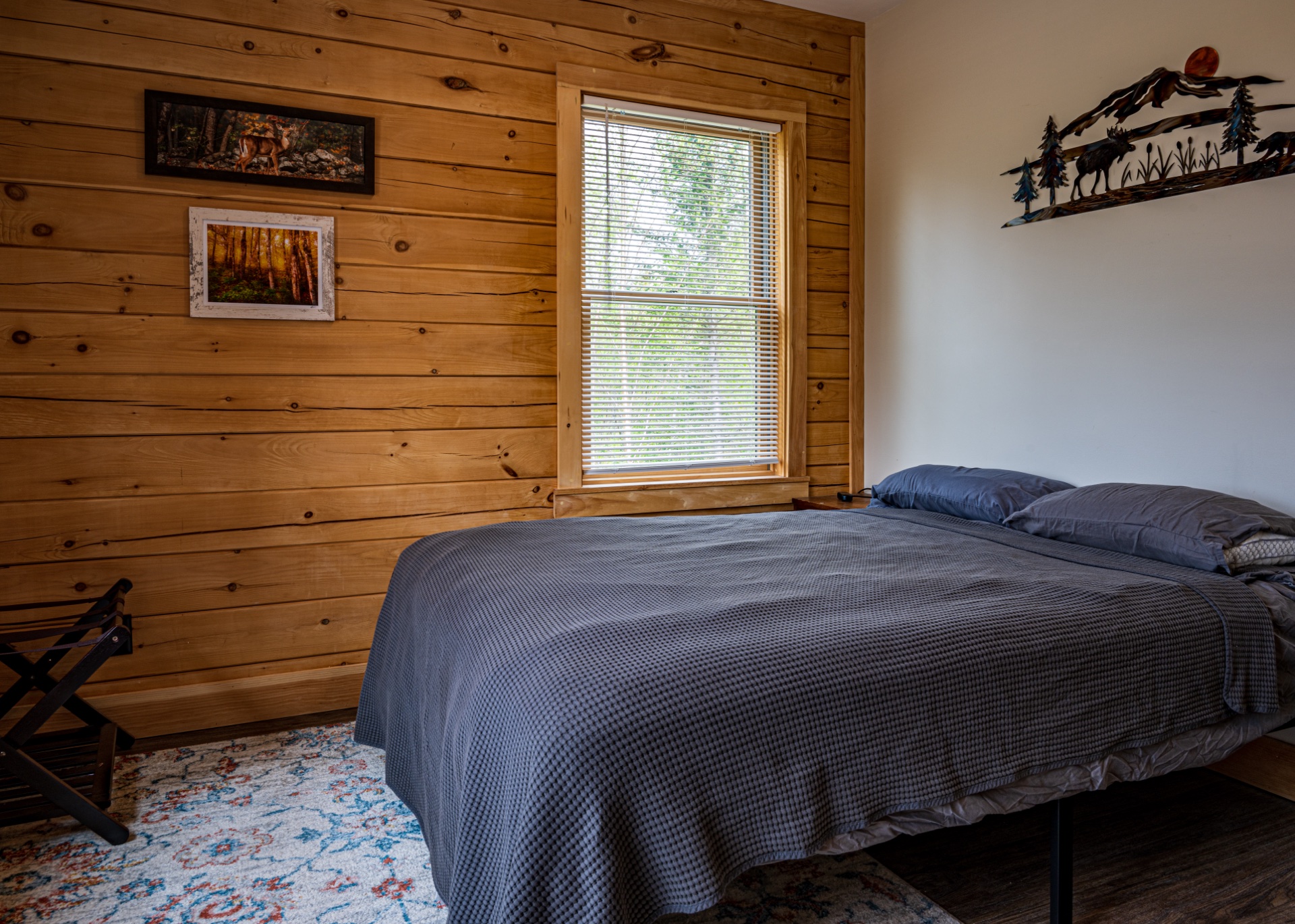 Sunapee bedroom with mountain wildlife metal wall art