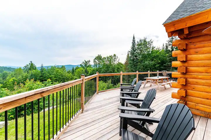 Sunapee deck with adirondack chairs facing the White Mountain view
