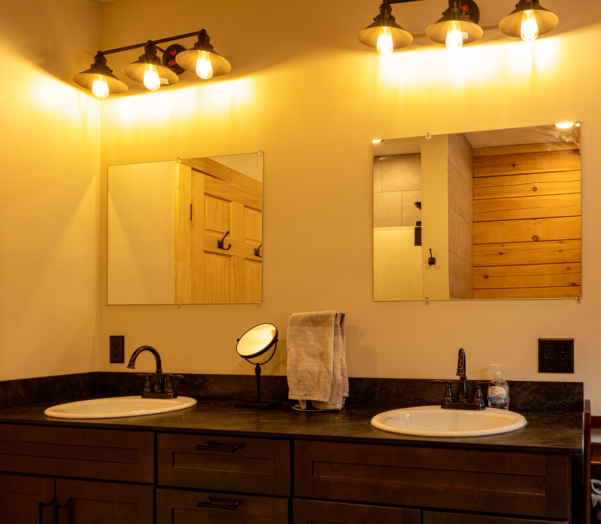 Sunapee master bathroom with double vanity and pendant lighting