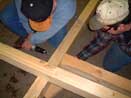 Securing cross braces to skid joist - Log Cabin Kit Picture